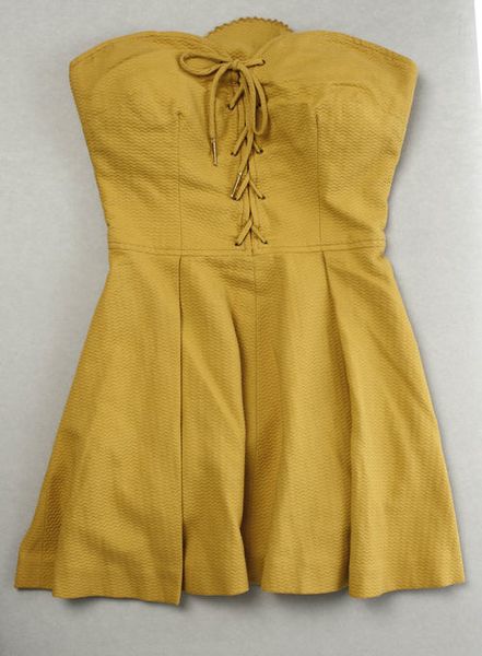 A corset-like strapless bathing suit by Tom Brigance, 1952.