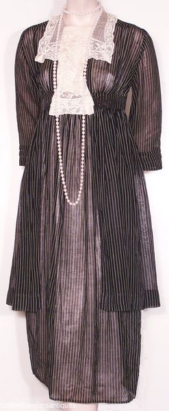 1914 ... Day Dress ... sheer black and white striped lawn dress with a separate overskirt, a ruffle…