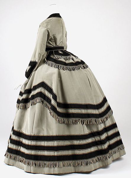 Grey and black silk wedding dress (back), American, 1866-69. Worn with matching grey silk side-lace…