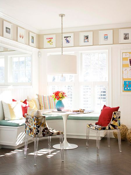 I love how they created a gallery of frames above the large window. I think the colorful artwork ti…